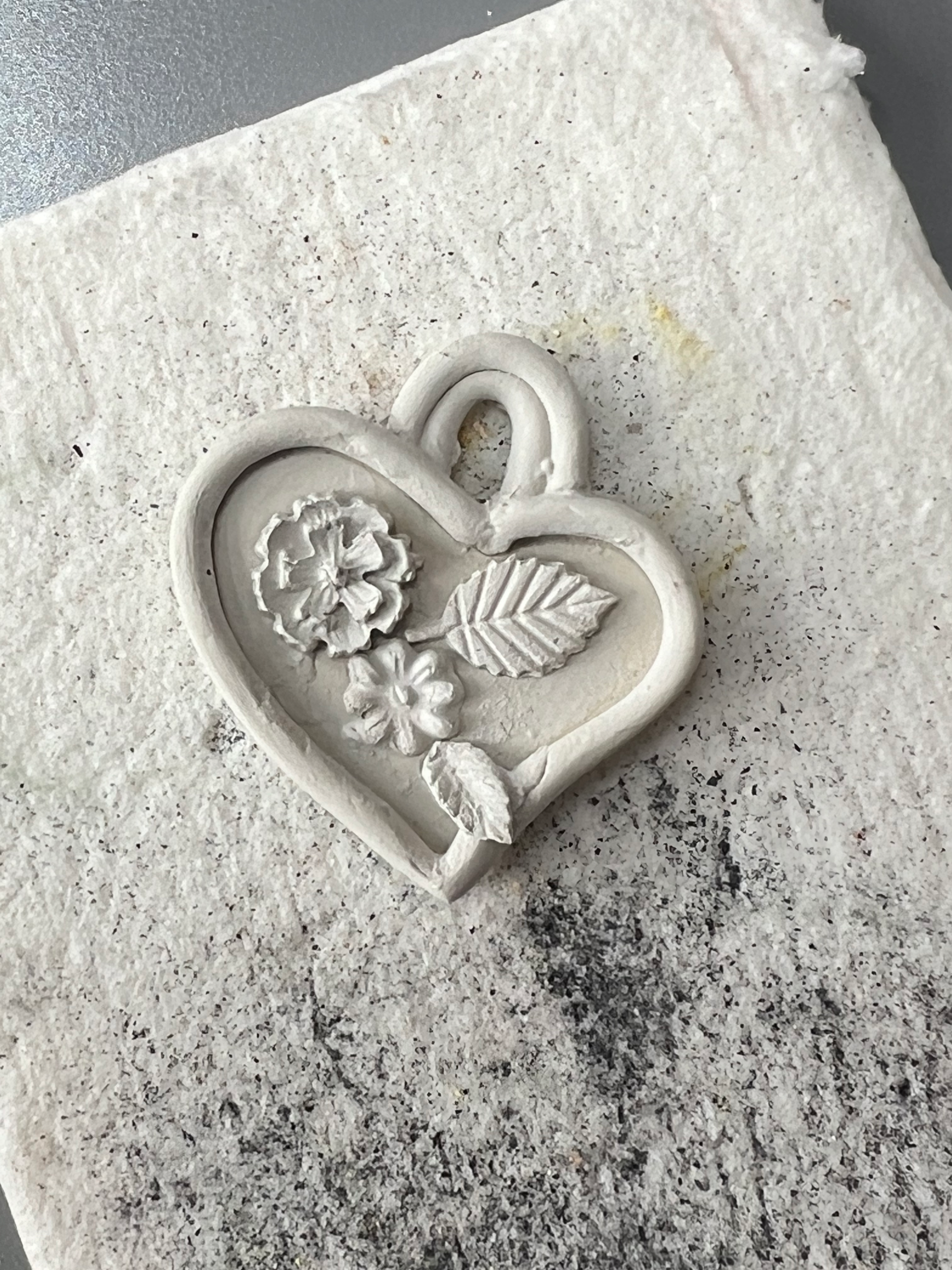 Heart made of silver clay. example, with small ornaments, silver clay pendant